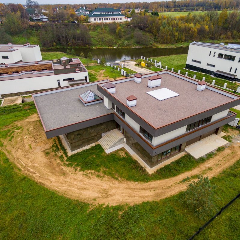 Modern country houses under construction as seen from air